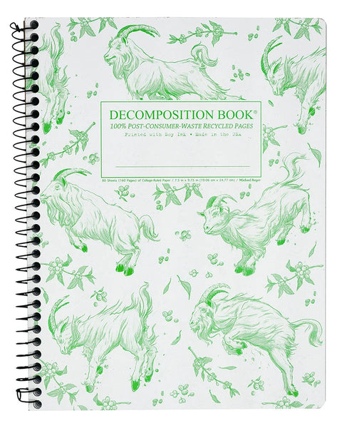 A spiral-bound decomposition book with a white cover decorated with green line drawings of goats. The center features a green-bordered label that reads 'DECOMPOSITION BOOK' with additional text below. Printed with Soy Ink. Made in the USA