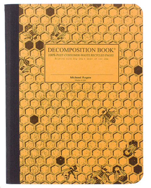A decomposition book with a honeycomb pattern cover featuring bees and a central label that reads 'DECOMPOSITION BOOK' and 100% Post-Consumer-Waste Recycled Pages. Printed with Soy Ink. Made in the USA.