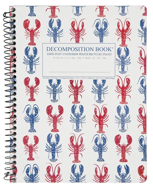 A spiral-bound decomposition book with a white cover printed with a repeating pattern of red and blue lobsters. The center label reads 'DECOMPOSITION BOOK' and '100% POST-CONSUMER WASTE RECYCLED PAGES'.