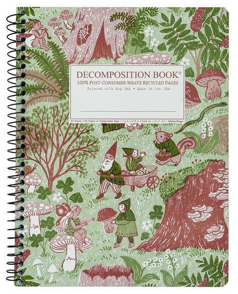 A spiral-bound decomposition/recycling book with a whimsical woodland cover illustration in muted green, pink, and brown tones. The front cover reads “DECOMPOSITION BOOK” and “100% POST-CONSUMER WASTE RECYCLED PAPER,” with a white label area near the top center.
