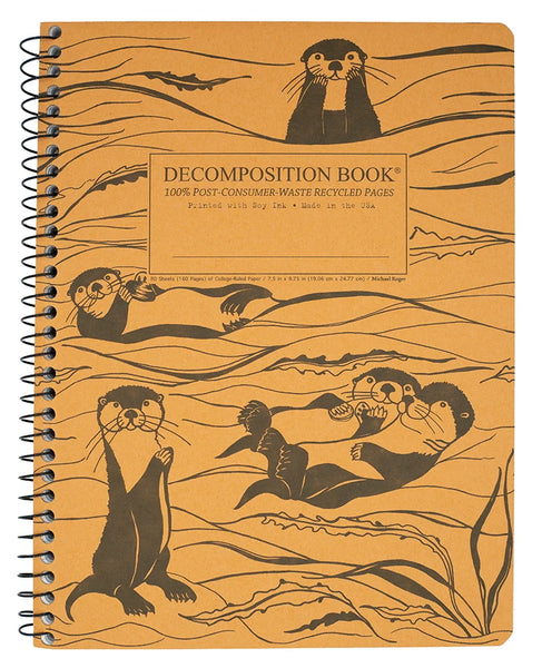 A spiral-bound decomposition notebook with a tan cover printed with black illustrations of otters and kelp, plus a central label that reads 'DECOMPOSITION BOOK' and '100% POST-CONSUMER WASTE RECYCLED PAGES.'. Printed with Soy Ink. Made in the USA