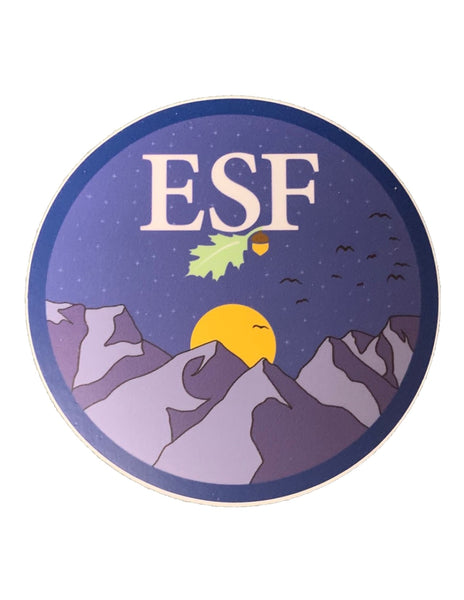A circular sticker with a design that includes mountains, birds, a moon, and the ESF logo.